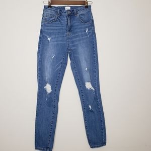 Ripped high rise skinny jeans in size 5